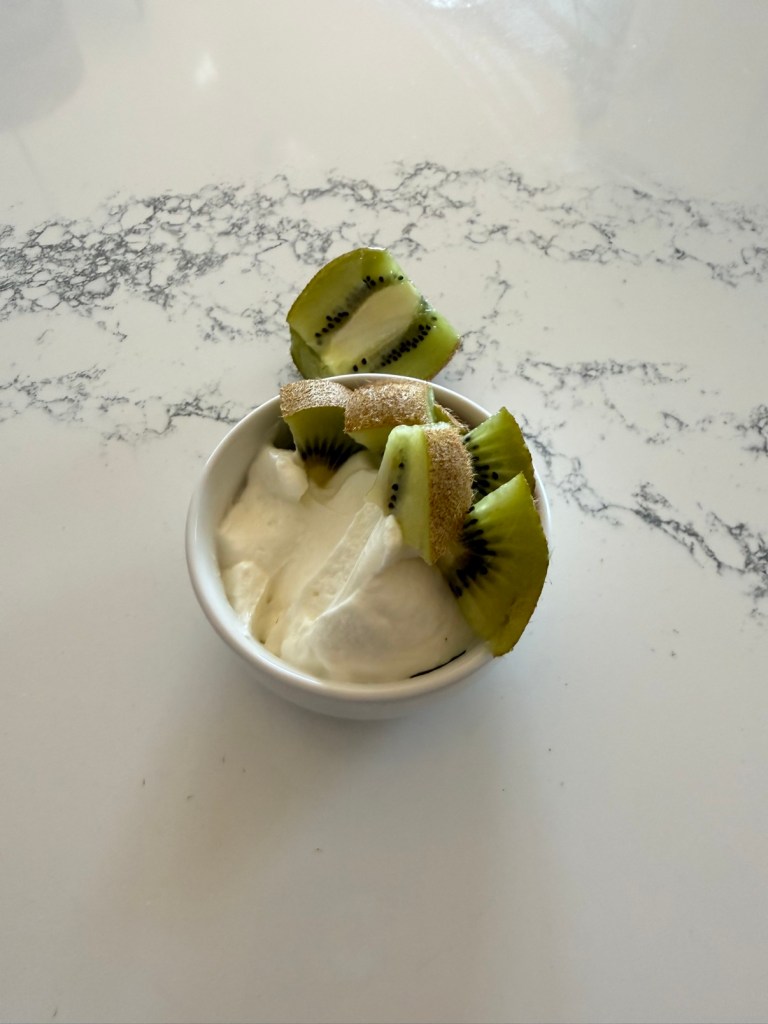 Kiwi slices with the peel on over Greek yogurt